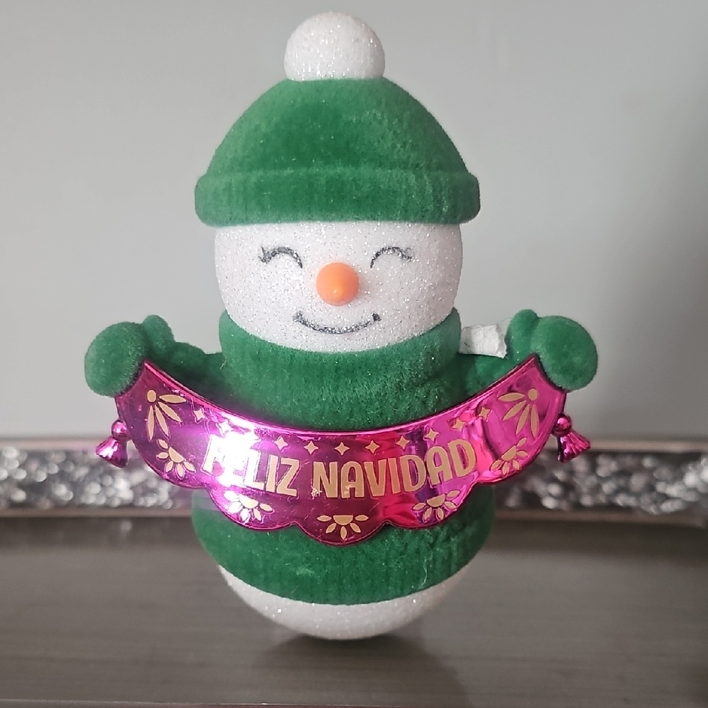 Cheerful Snowman with Green Hat and Pink Banner